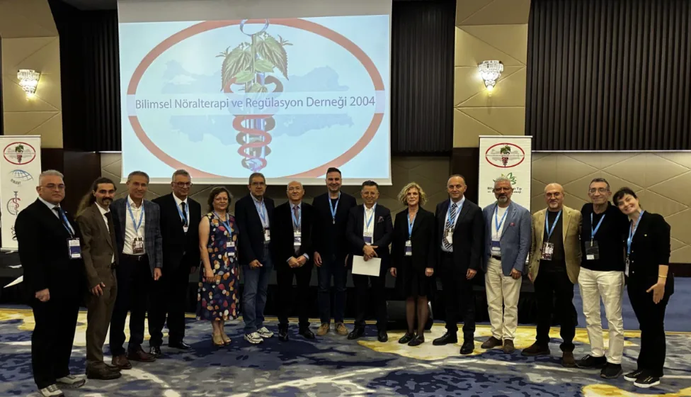 Speakers and members of the scientific committee in front of the BNR screen