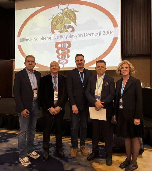 A group of symposium participants in the meeting hall